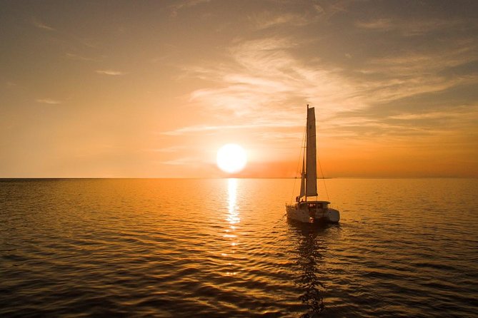 Santorini Luxury Catamaran Sunset Cruise with BBQ, Drink and Transfer - White Beach swim and Greek BBQ on board