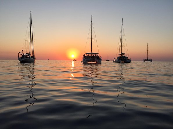 Santorini Luxury Catamaran Sunset Cruise with BBQ, Drink and Transfer - Getting there and what to pack for a smooth swim day