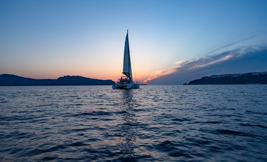 Santorini: Luxury Sunset Cruise with Dinner & Open Bar - Pickup, live guide, and onboard setup you’ll actually use