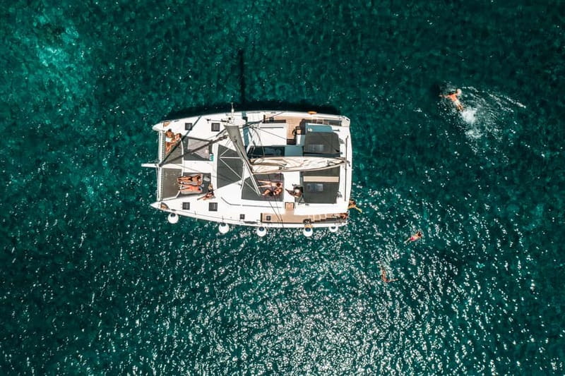 Santorini: Majestic Catamaran Cruise with Meal and Drinks - Day Cruise vs Sunset Cruise, Starting at Ammoudi
