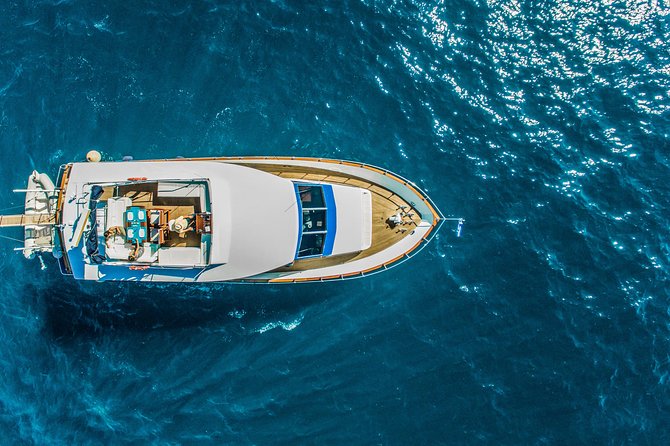 Santorini: Motor Yacht Day Cruise with 5-Course Lunch - Getting on board: pickup, timing, and how the day starts
