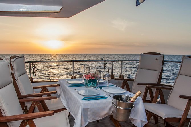 Santorini: Motor Yacht Sunset Cruise with 5-Course Dinner - Swimming and snorkeling: Mesa Pigadia and the volcano stops