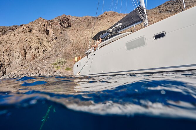 Santorini Oia: Caldera Luxury Day Cruise with BBQ & Drinks - Stop 1, Thirassia: calm water near Oia and a quick reset