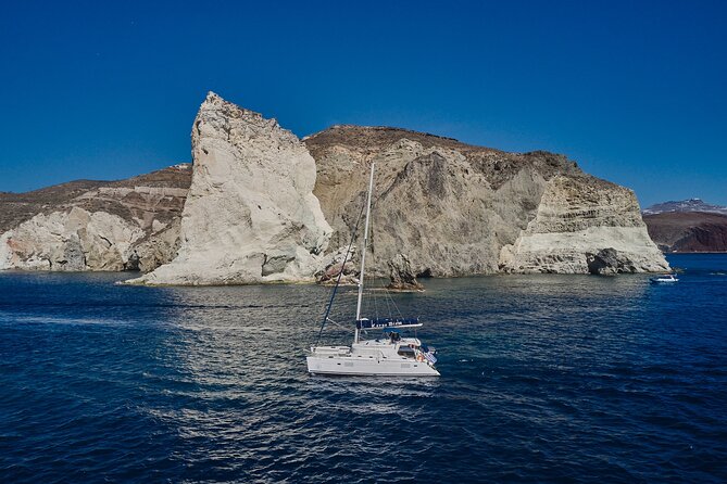 Santorini Oia: Luxury Sunset Cruise with Fresh Fish BBQ & Drinks - Getting There: Where to Meet and How the Day Flows