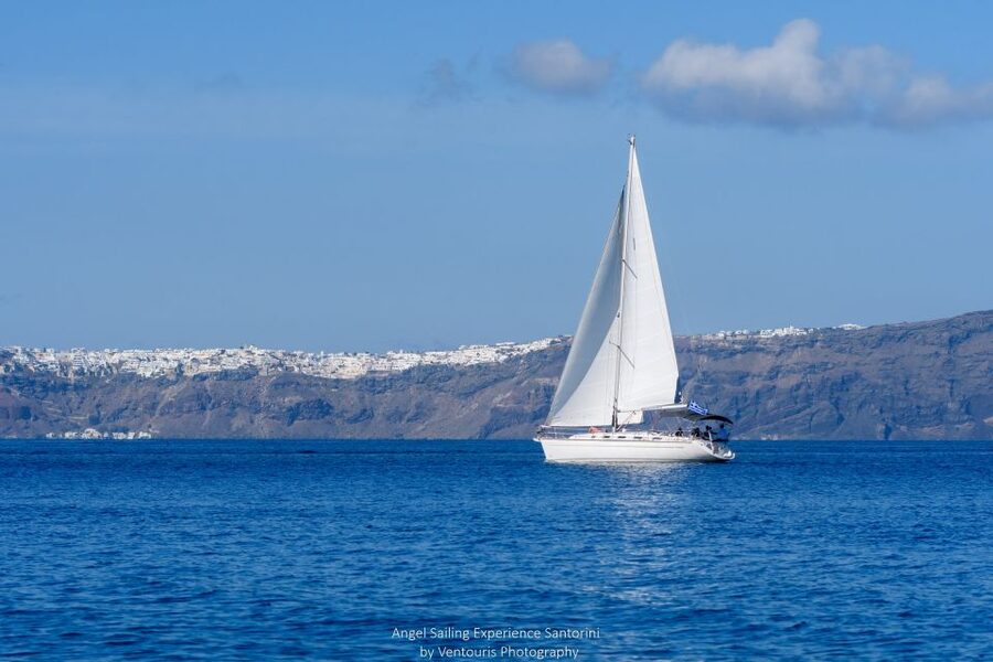 Santorini: Private 5-Hour Sunset Sailing Tour with Dinner - First views inside the caldera: lighthouse, hot springs, and photo-ready angles