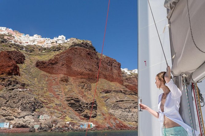 Santorini Private Catamaran Cruise with BBQ, Open Bar & Transfers - Mesa Pigadia bay: swim or relax while staying on board