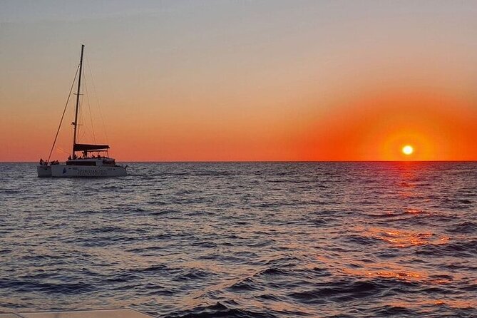 Santorini Private Catamaran Cruise with BBQ, Open Bar & Transfers - BBQ on board at Palea Kameni: food, drinks, and that rare relaxed meal