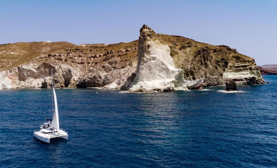 Santorini: Private Day Cruise with a BBQ meal and Open Bar - Red, White, Black, and a Caldera Lighthouse Stop