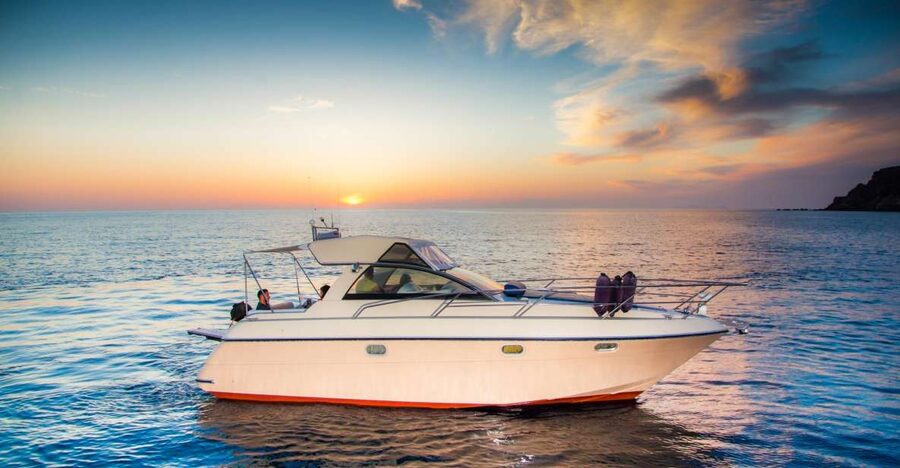 Santorini: Private Day Cruise with Barbeque and Drinks - Oia on a walking pace, with whitewashed house views