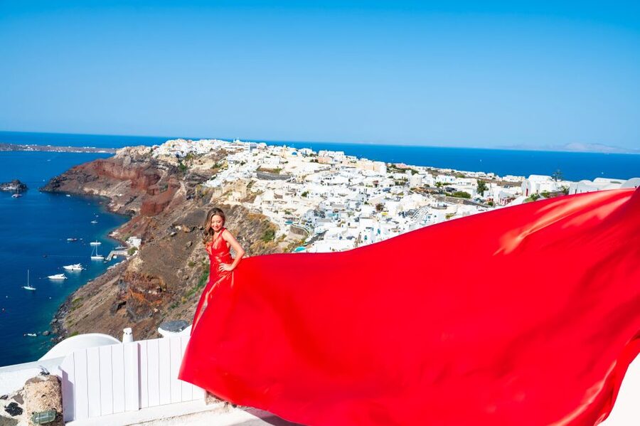 Santorini: Private Flying Dress Photoshoot with Pickup - Stop 1 in the classic blue-domes world of Oia