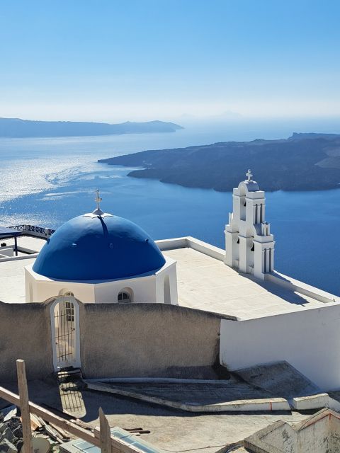 Santorini: Private Sightseeing Half-Day Tour - Red Beach in Akrotiri: volcanic rock drama in bright sea water