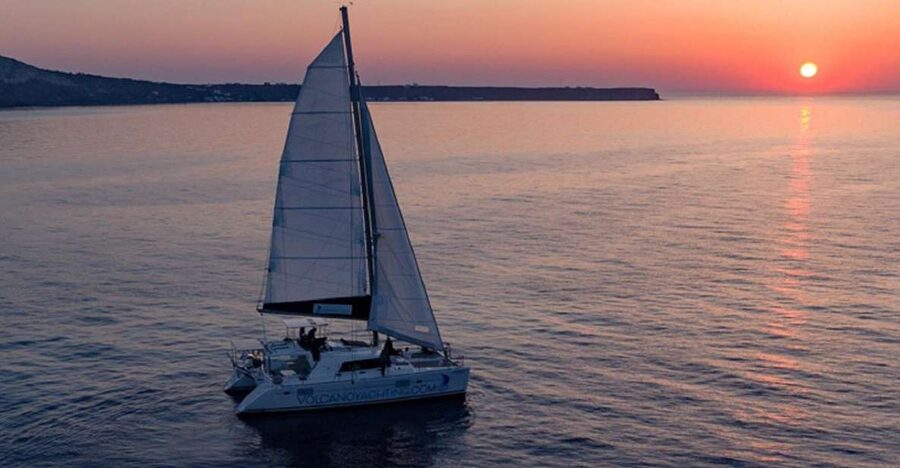 Santorini: Private Sunset Cruise with Dinner and Drinks - The beach color circuit: Red, White, Black Mountain, and a lighthouse moment