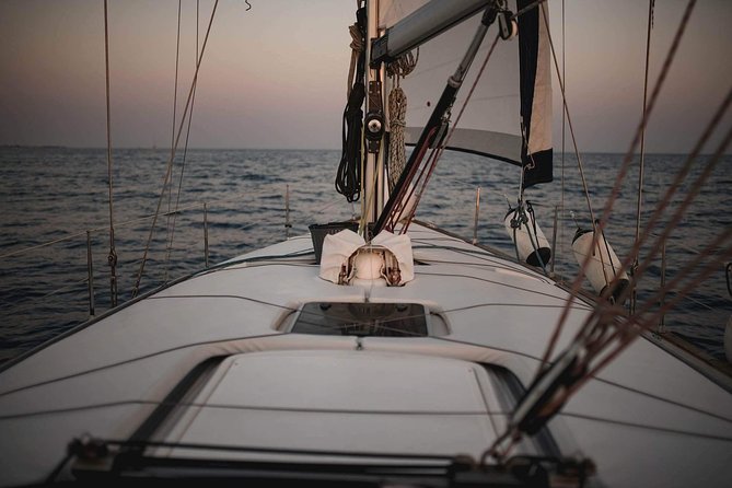 Santorini Private Sunset Sailing Tour with Dinner, Drinks &Transfer included - Thirassia swim time, eastward caldera views, and dinner on board