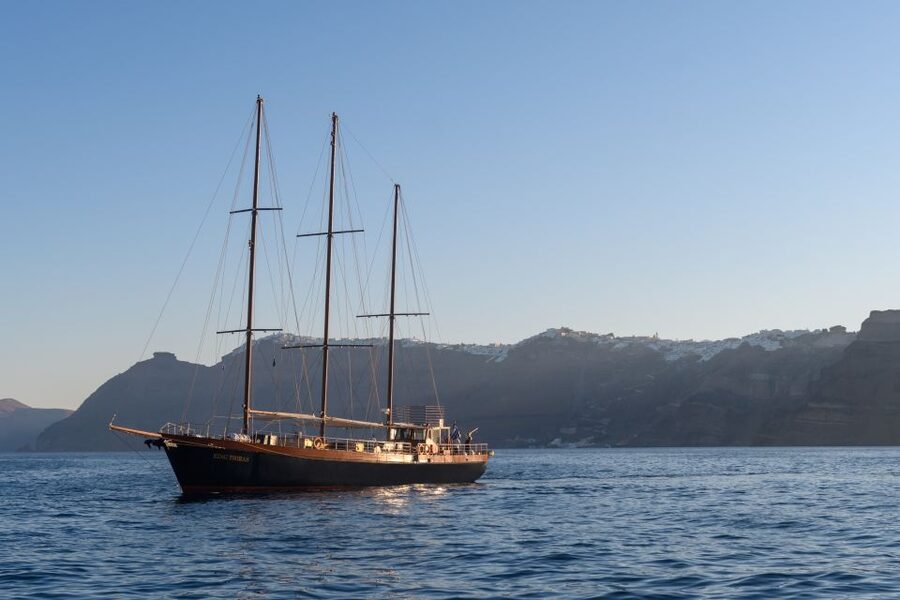 Santorini: Romantic Sunset Caldera Cruise with Dinner - Stepping Onto the King Thiras: Welcome Drinks, Crew Service, and Setup