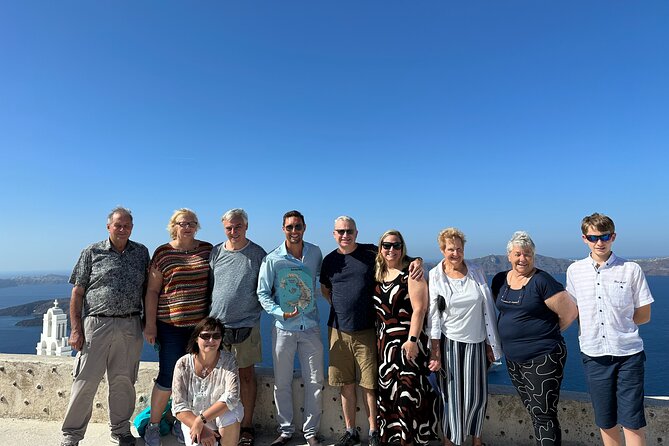 Santorini's Iconic Villages: Oia, Imerovigli & Firostefani - Stop 3: Finikia Photo Stop at IKIES Santorini, Oia in the Distance