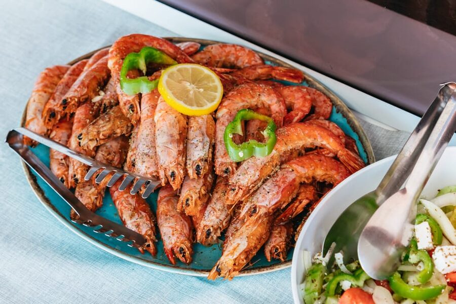 Santorini: Sailing Catamaran Cruise with BBQ and Drinks - Mesa Pigádia: longest swim, snorkeling, and the BBQ center of the day