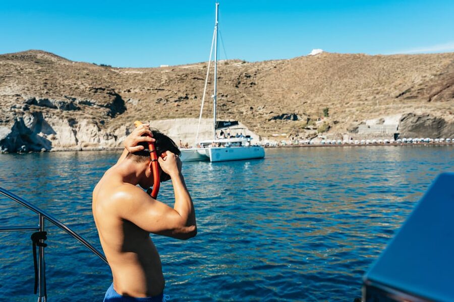 Santorini: Sailing Catamaran Cruise with BBQ and Drinks - Vlychada Port safety briefing, then straight into the fun