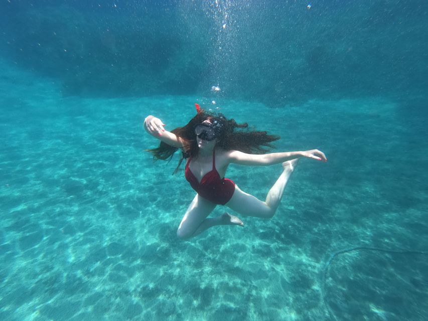 Santorini: Sea Caves Kayak Trip with Snorkeling and Picnic - Paddling Santorini’s south coast in a small group