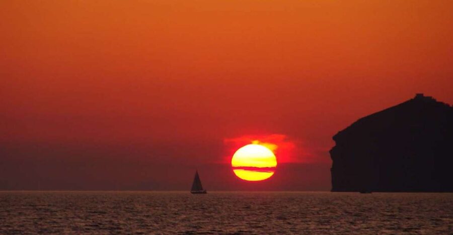 Santorini: Sunset Cruise with Greek Dinner and Transfer - Timing and expectations: when sunset hits and how to prepare