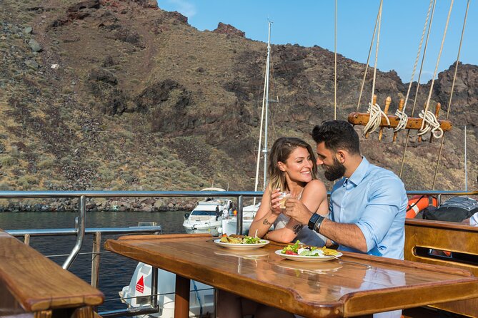 Santorini Sunset Dinner Cruise Including Nea Kameni Visit - The ship experience: decks, shade, and getting the best seats