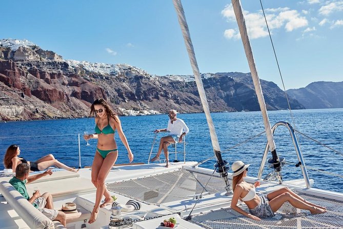 Santorini Sunset Luxury Sailing Catamaran Cruise with BBQ, drinks, transfer - White Beach and the BBQ timeline, the moment most people remember