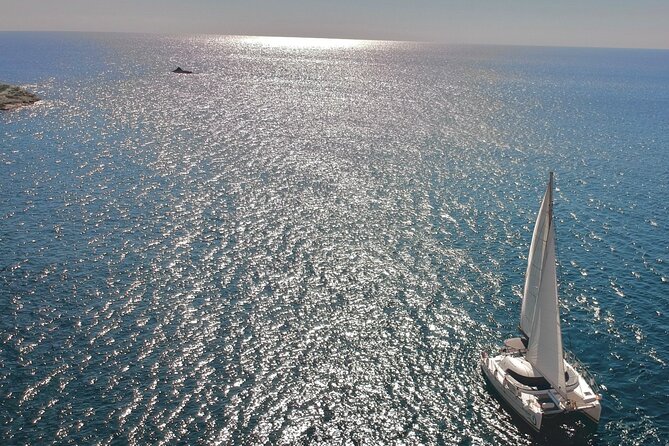 Santorini Sunset:Private All-In Catamaran Cruise (Food&Drinks) - Past the lighthouse colors: Indian Rocks and the view that feels like a preview of the sunset