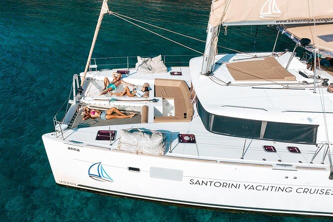 Santorini Sunset Sailing Cruise: Dinner, BBQ, Open Bar, Transfers - Red Beach Stop: Colorful Views and a Real Swim Hour