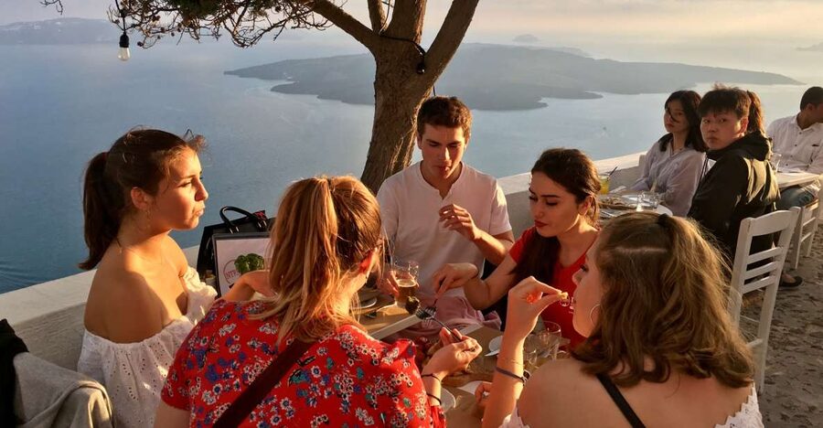 Santorini: Sunset Walking Tour with Local Food and Drinks - Meeting point and the walking reality: what your feet need to know