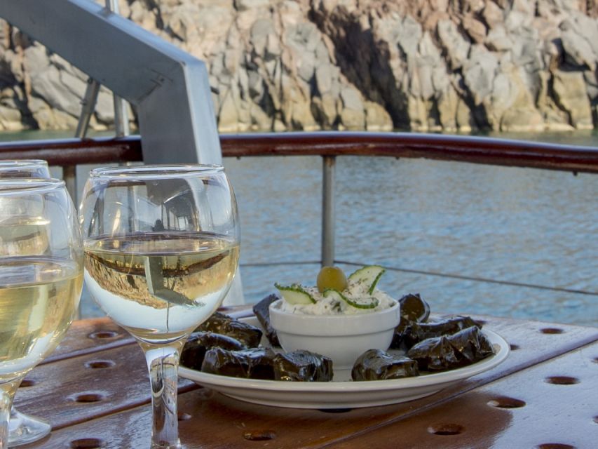 Santorini: Traditional Wooden Boat Tour with Meal and Wine - Wooden-Boat Caldera Time, Without the Crowds Feeling Like Part of the Deal