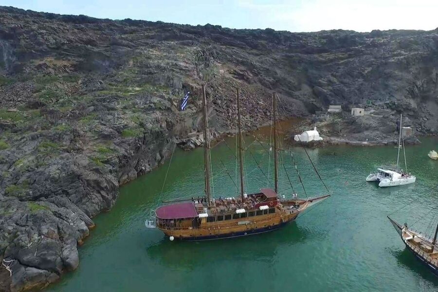Santorini: Volcanic Sunset Cruise with Dinner - From Athinios Port to the caldera: how the 8 hours usually work