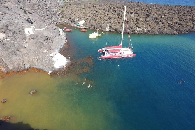 Sunset Sailing Catamaran Cruise in Santorini with BBQ and Drinks - Hot springs swim: warm water, sulfur smell, and short timing