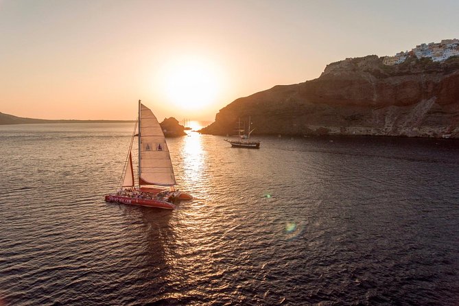 Sunset Sailing Catamaran Cruise in Santorini with BBQ and Drinks - Getting on board: ports, shoes off, and what to bring